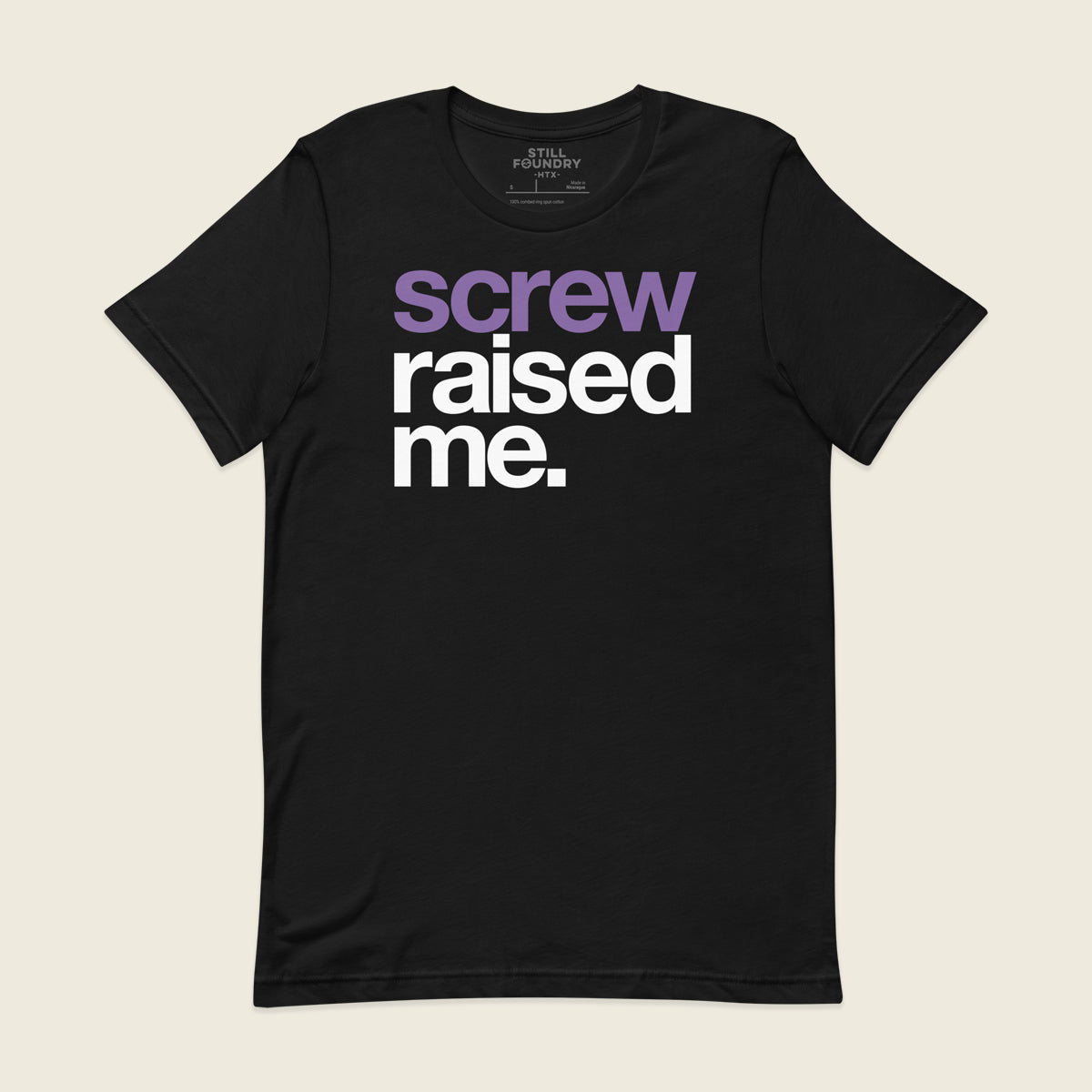 Black t-shirt with the phrase “screw raised me.” printed on the front in large bold letters, with “screw” in purple and “raised me.” in white.