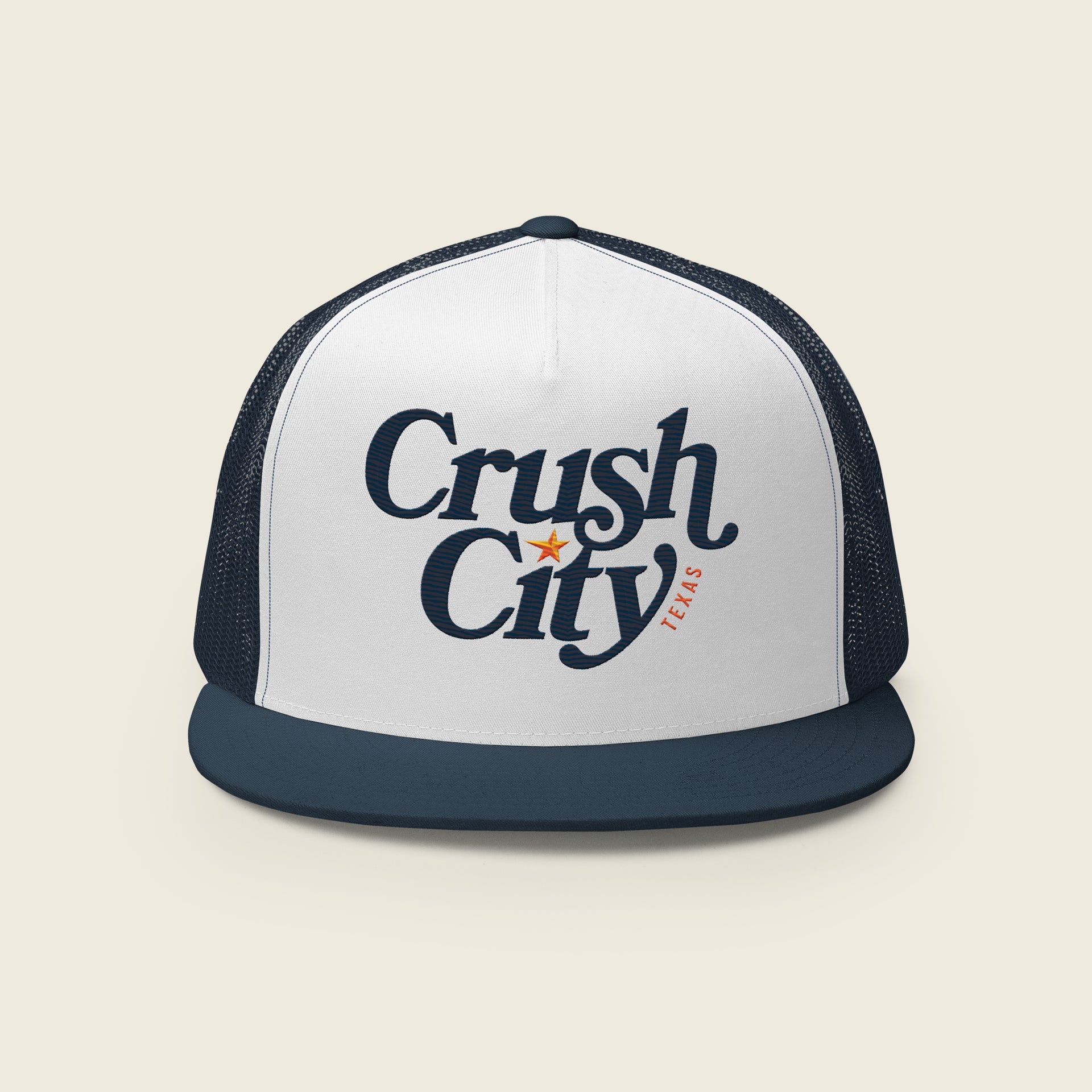 Navy and white trucker-style snapback hat with a white front panel featuring the text “Crush City” in bold navy script, a small orange star between the words, and “Texas” in orange lettering along the side.