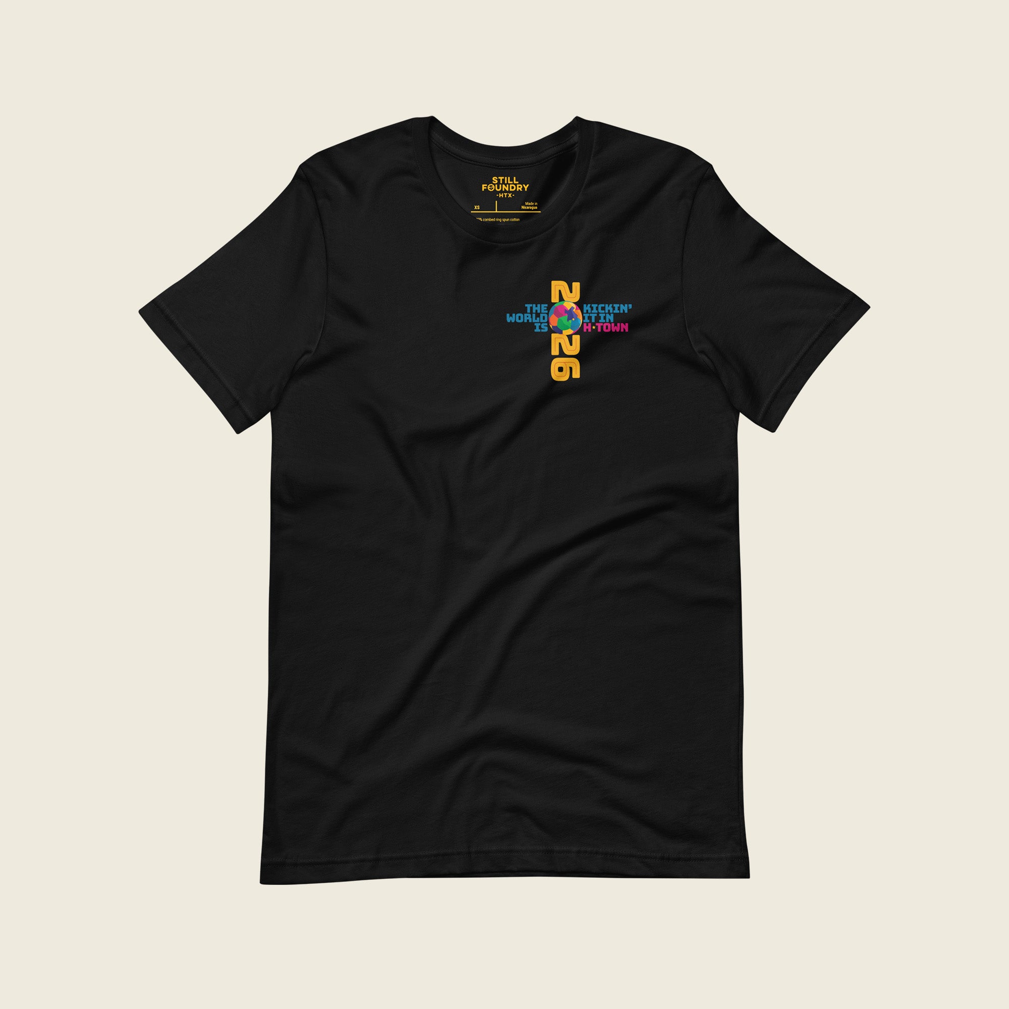 Front view of black Houston 2026 T-shirt with small “Kickin’ It in H-Town” chest graphic.