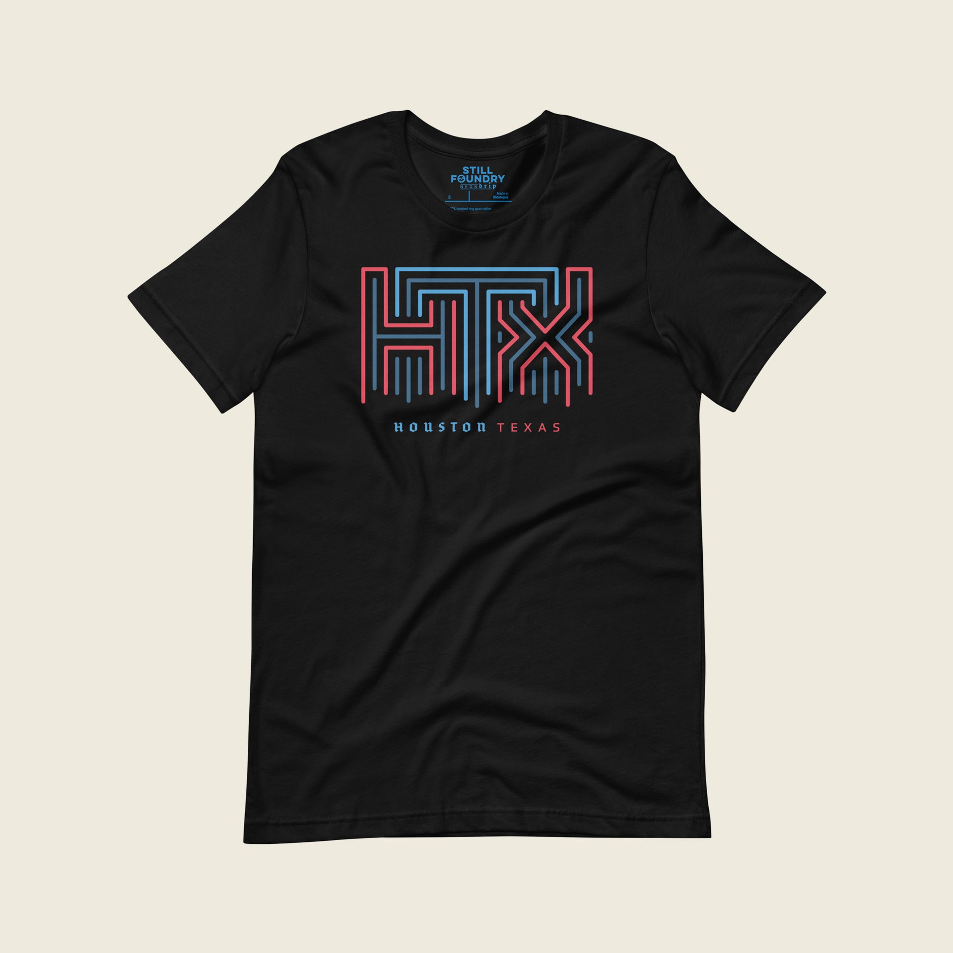 Black short-sleeve t-shirt laid flat with a large geometric neon sign “HTX” graphic in red and blue on the chest and the words “HOUSTON TEXAS” printed below in small blue and red letters.