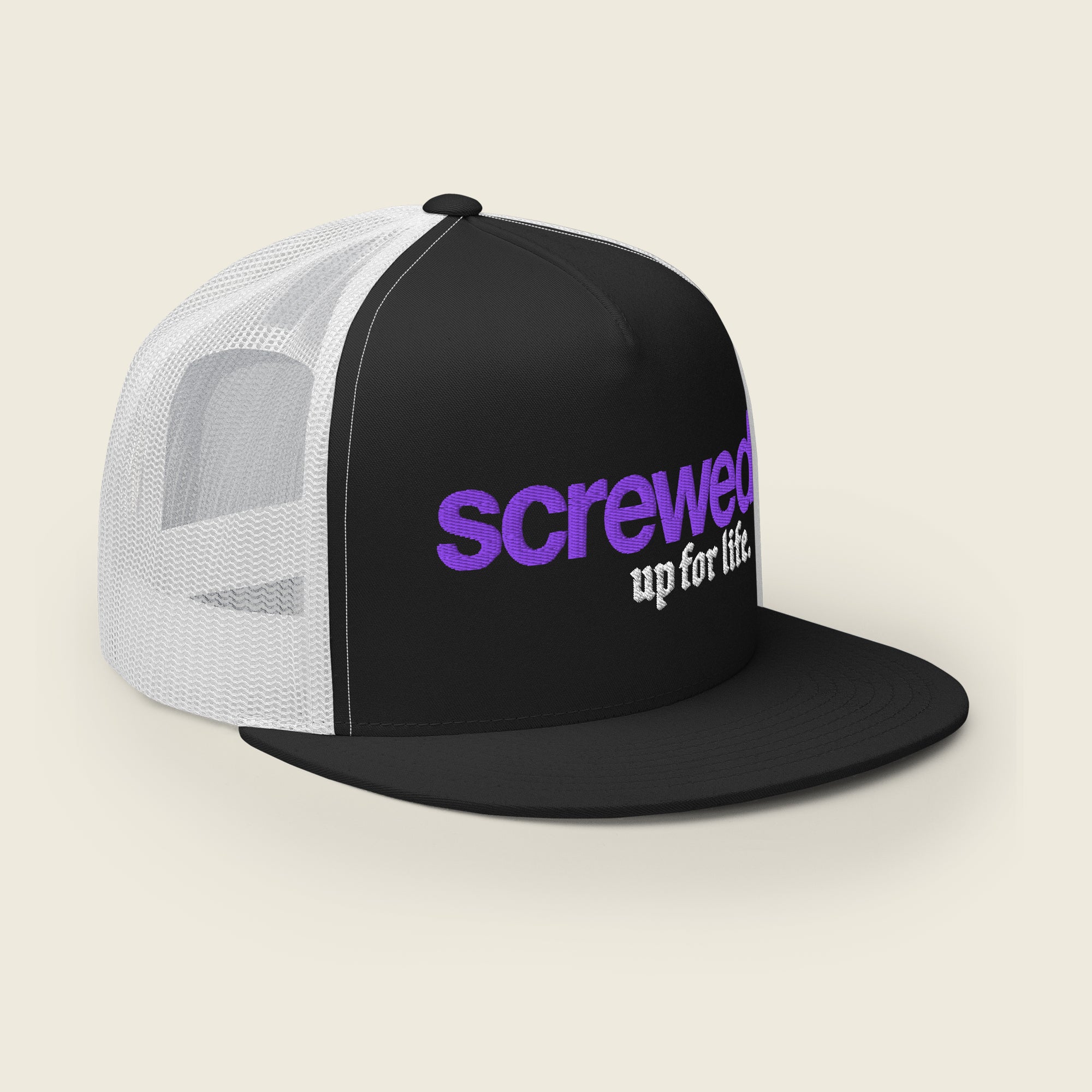 A black and white trucker snapback hat with a flat brim. The front panel features embroidered text in two styles: the word "screwed" in bold purple lowercase letters, and the phrase "up for life." in white Old English-style font beneath it. The mesh back of the hat is white, while the front and brim are black.